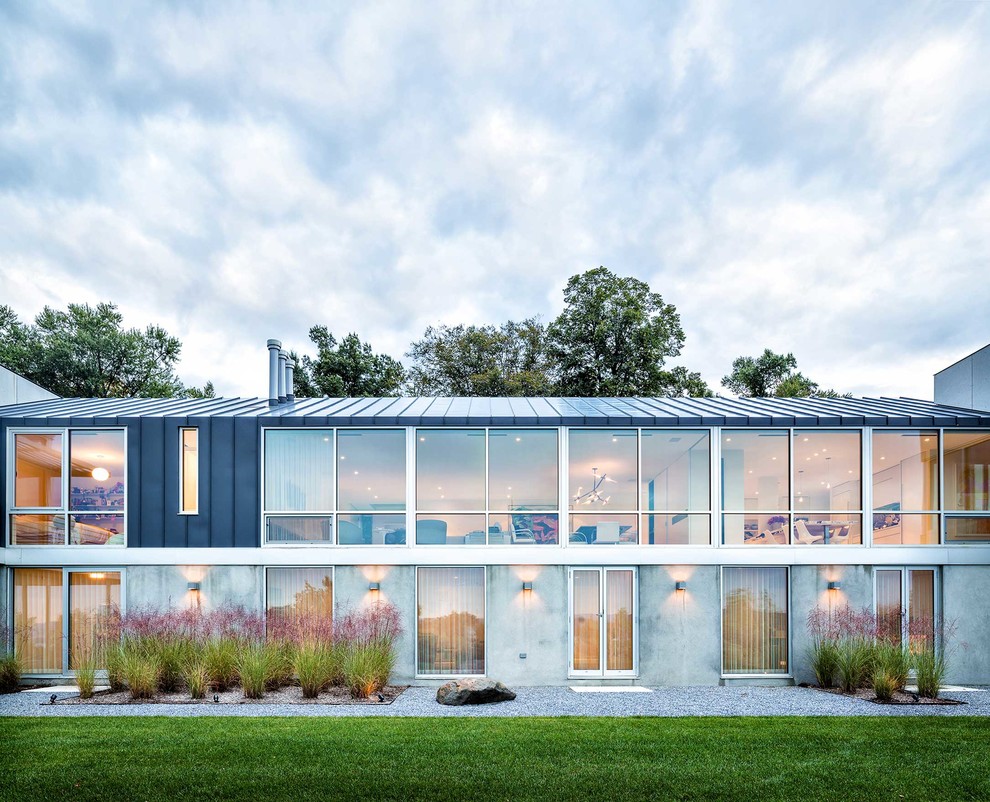 Стильный дизайн: двухэтажный дом в современном стиле с облицовкой из бетона - последний тренд