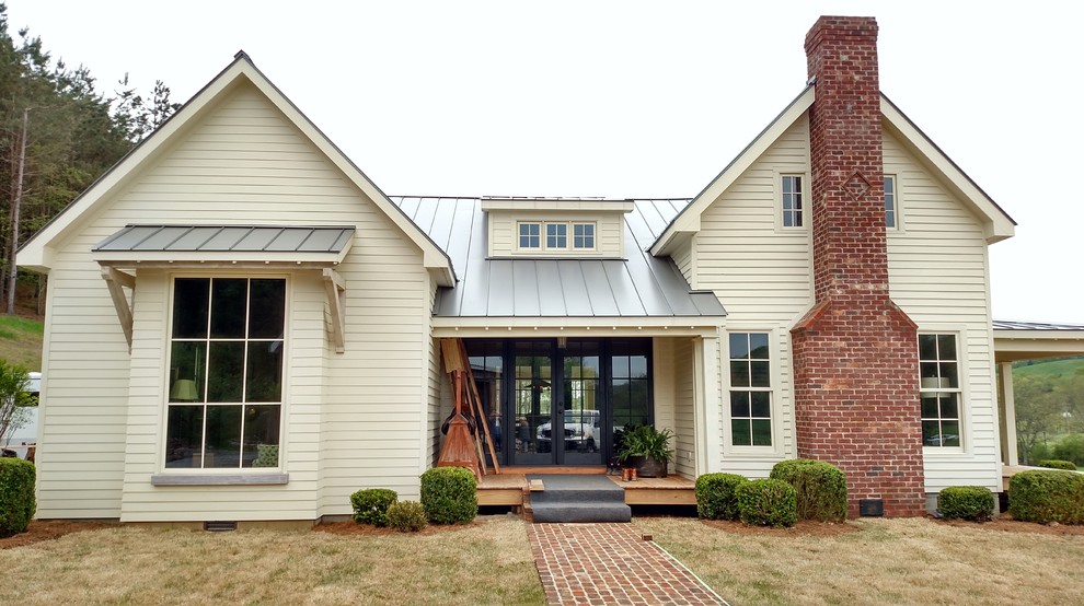 Inspiration for a medium sized farmhouse two floor house exterior in Nashville with concrete fibreboard cladding.