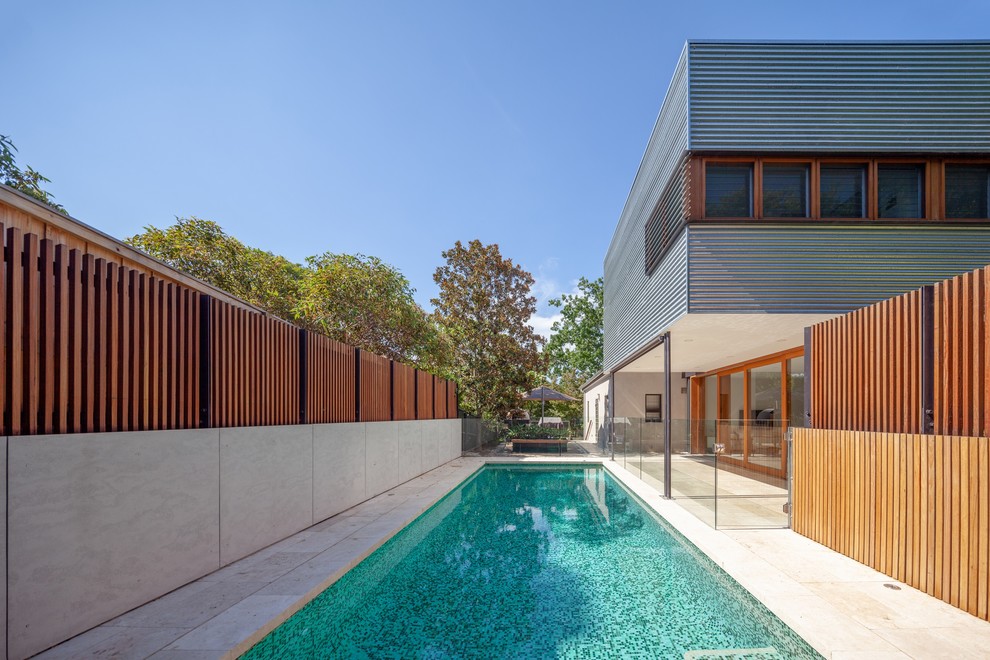 This is an example of a medium sized contemporary swimming pool in Sydney.