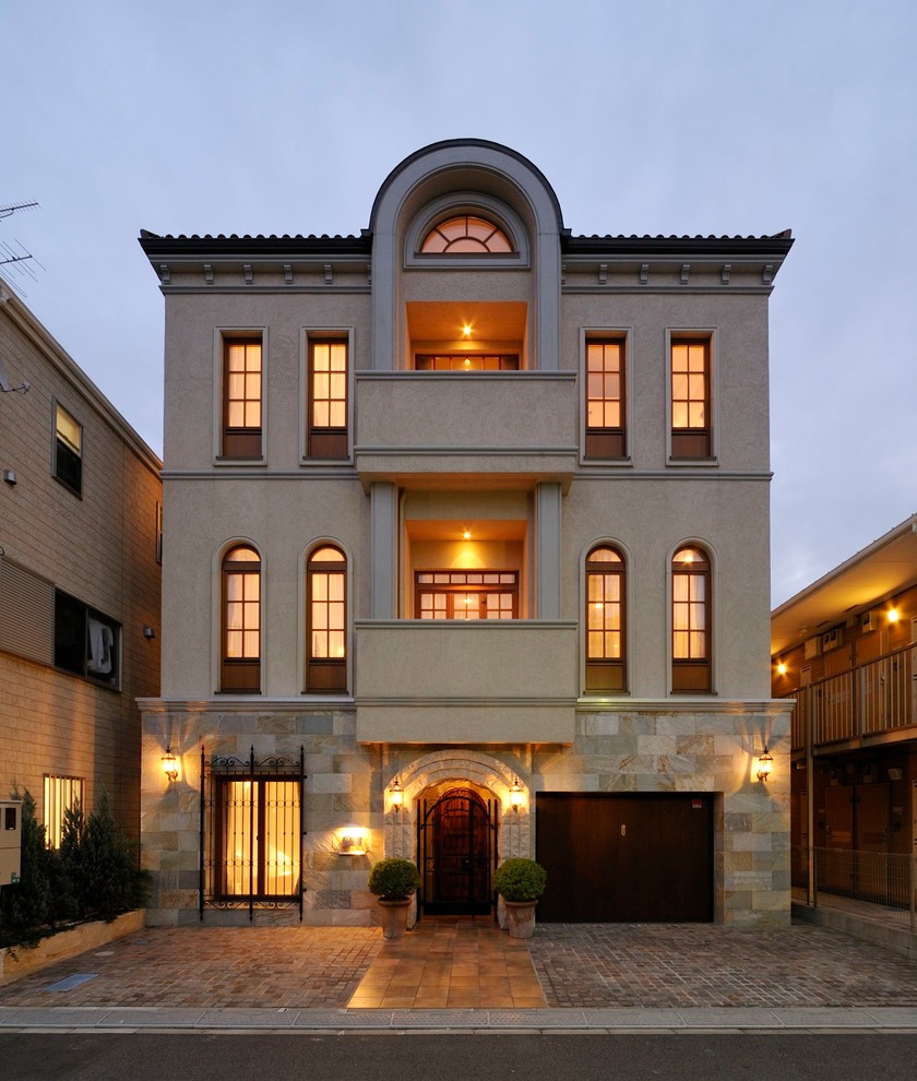 Huge elegant beige three-story flat roof photo in Tokyo