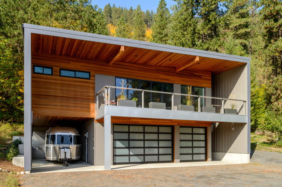 This is an example of a large and brown contemporary two floor detached house in Seattle with mixed cladding and a flat roof.
