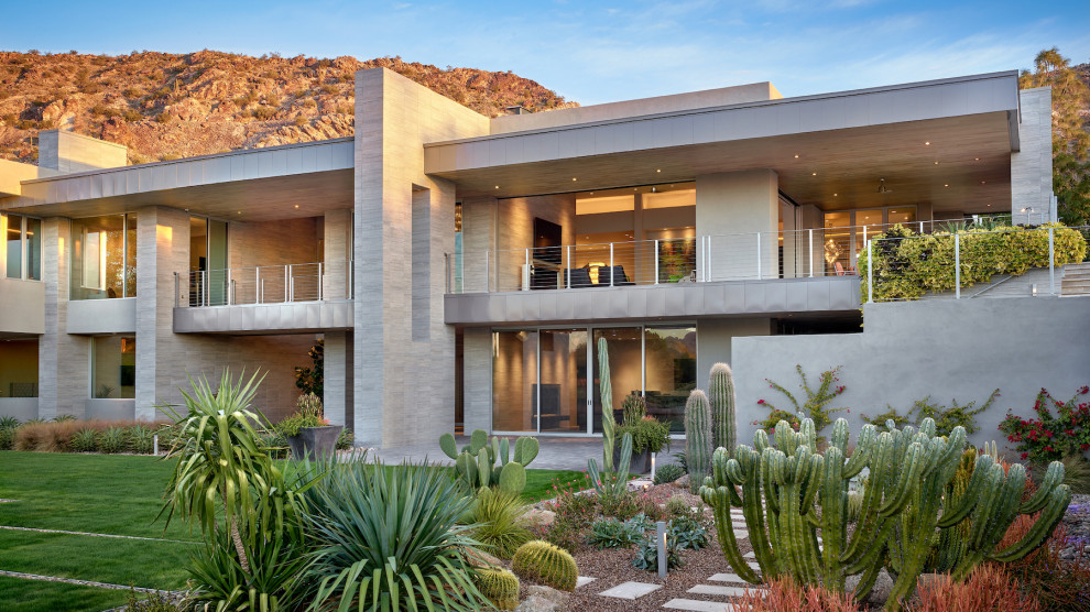 Diseño de fachada de casa beige minimalista extra grande de dos plantas con revestimiento de piedra y tejado plano