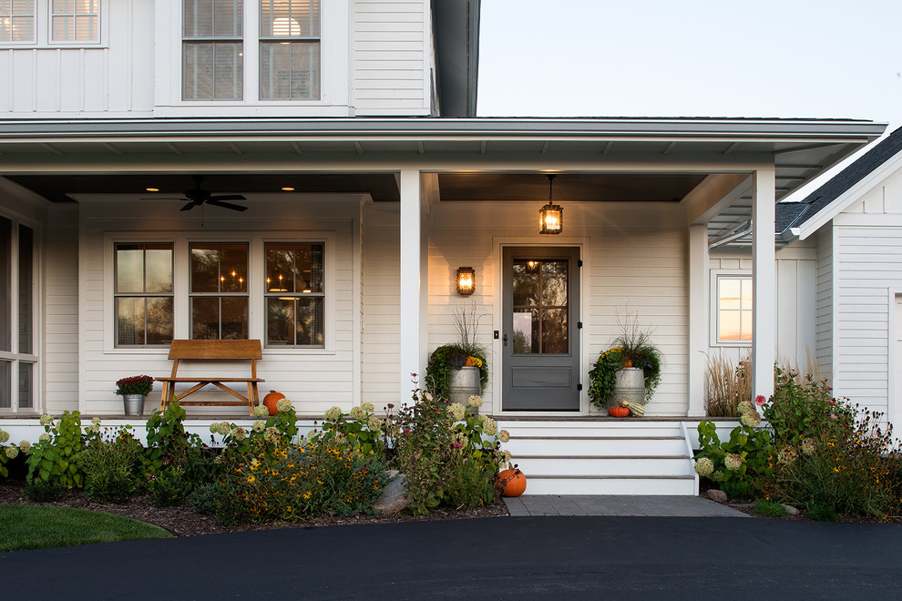 Example of a country exterior home design in Minneapolis
