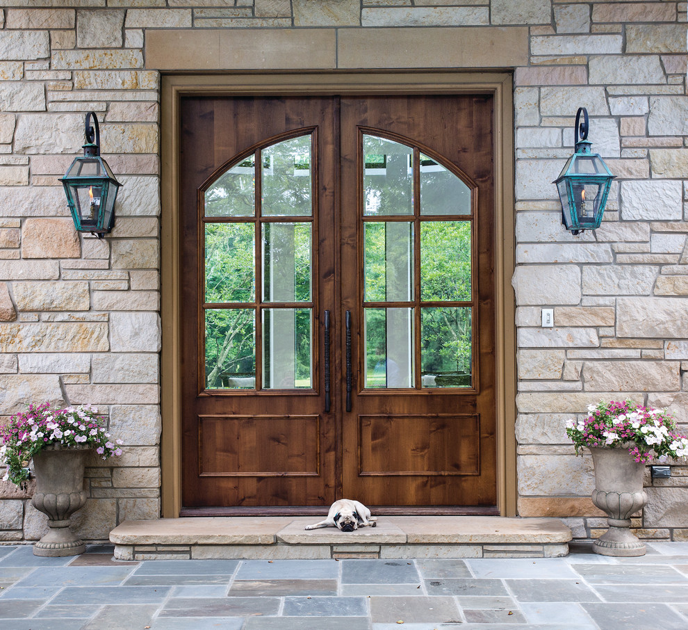 Inspiration for a large transitional brown two-story stone house exterior remodel in Cincinnati