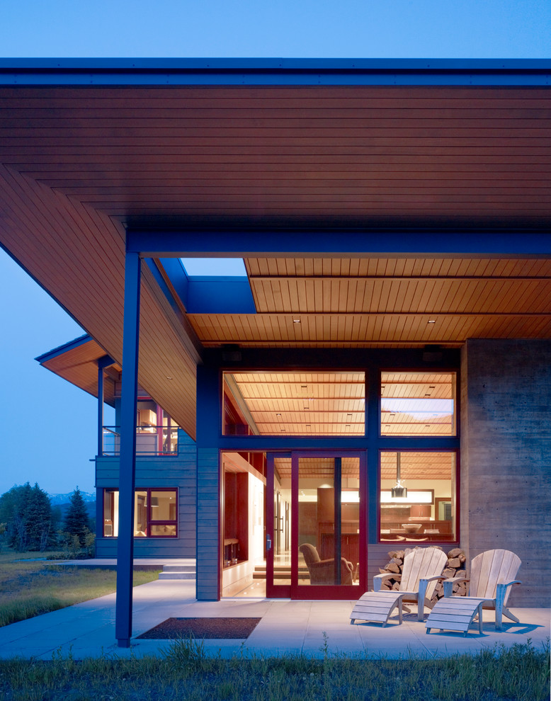 Photo of a modern house exterior in Other with wood cladding.