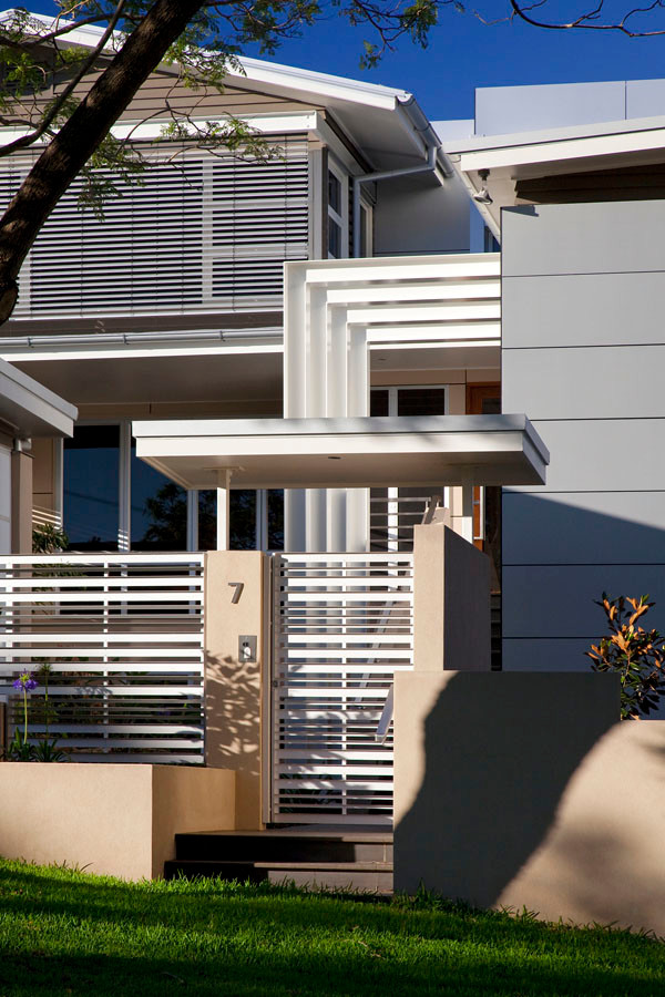 Huge trendy multicolored three-story house exterior photo in Brisbane with a metal roof