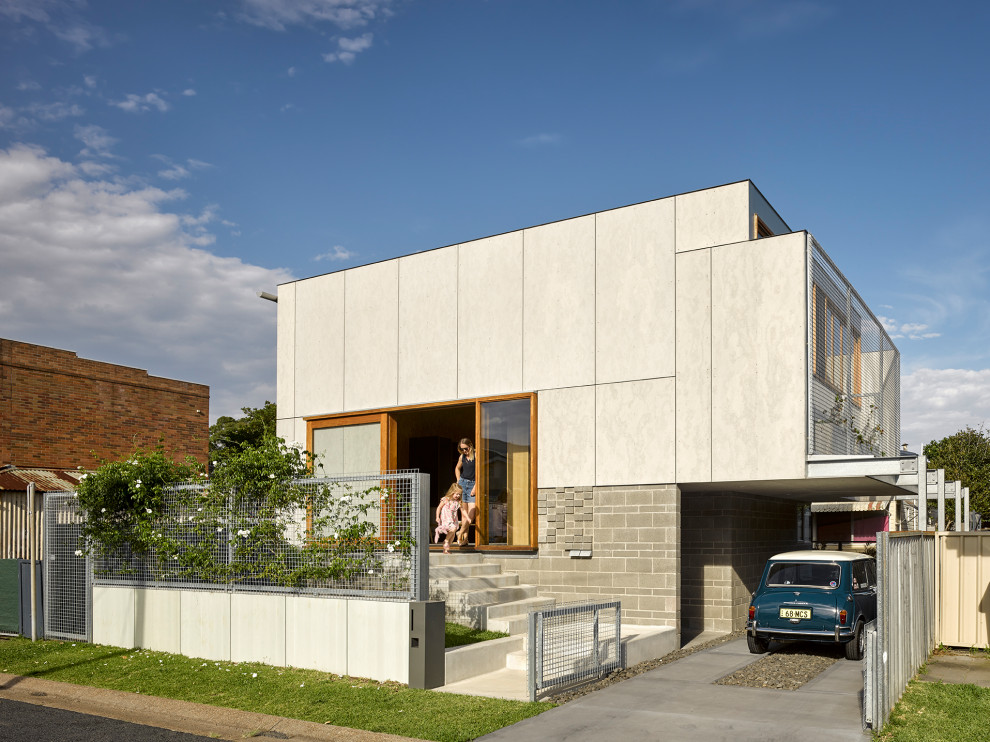 Diseño de fachada de casa gris urbana de una planta con tejado plano