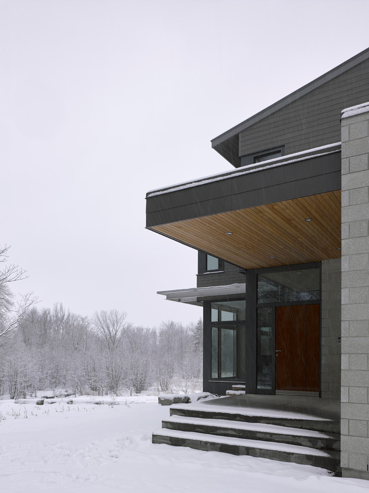 Inspiration for an expansive and gey modern two floor detached house in Ottawa with mixed cladding, a lean-to roof and a metal roof.