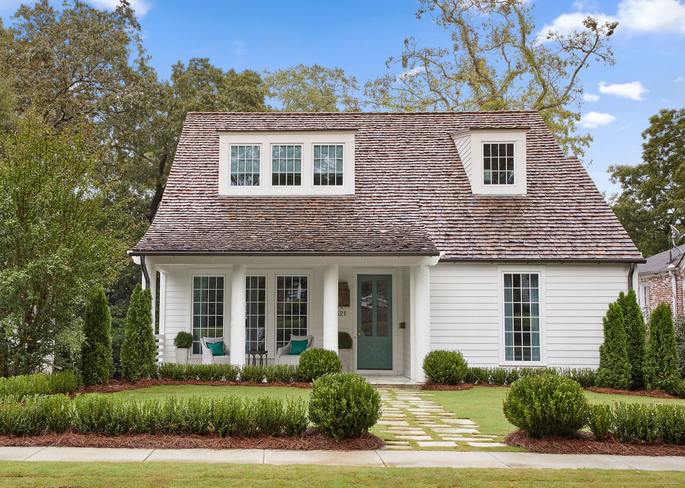 Inspiration for a timeless white two-story wood house exterior remodel in Birmingham with a hip roof and a shingle roof