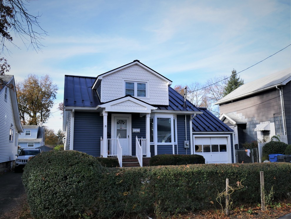 Installing Charcoal Grey Standing Seam Metal Roof on Cape CodStyle