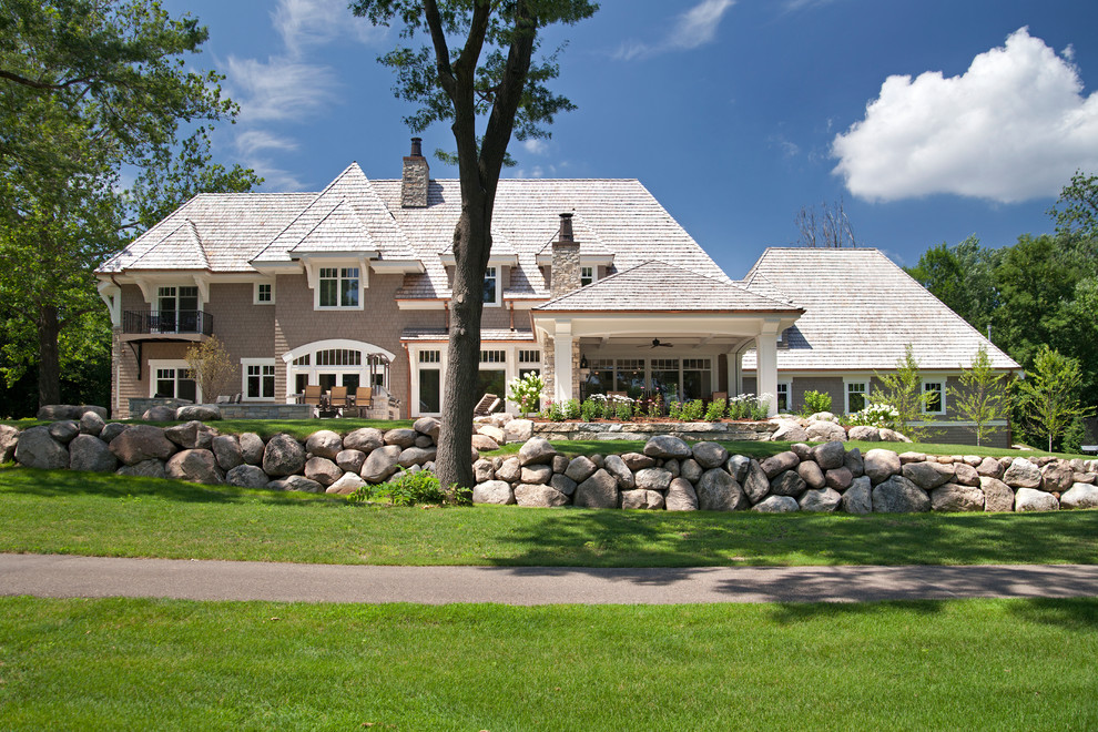 Example of a classic gray two-story exterior home design in Minneapolis