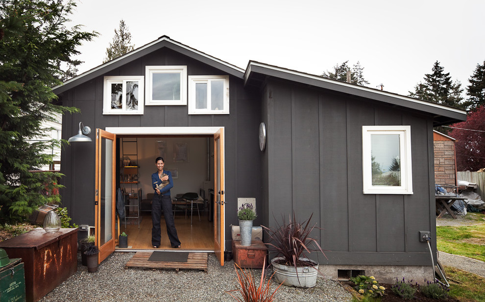Small transitional one-story wood exterior home photo in Other