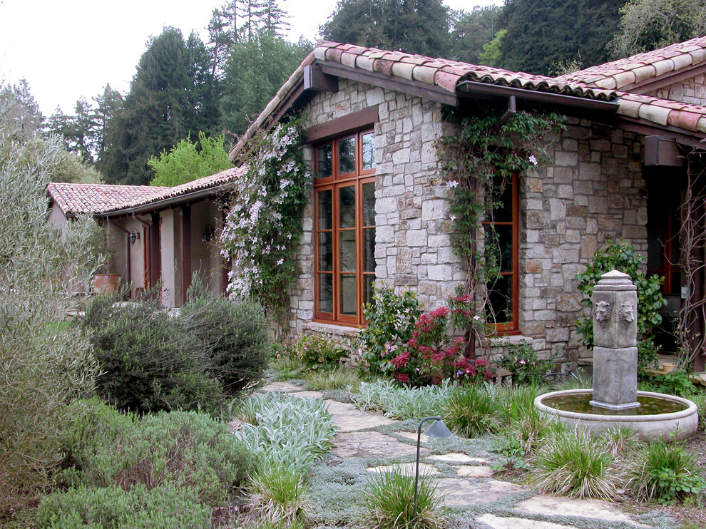Example of a mid-sized classic stone exterior home design in Other