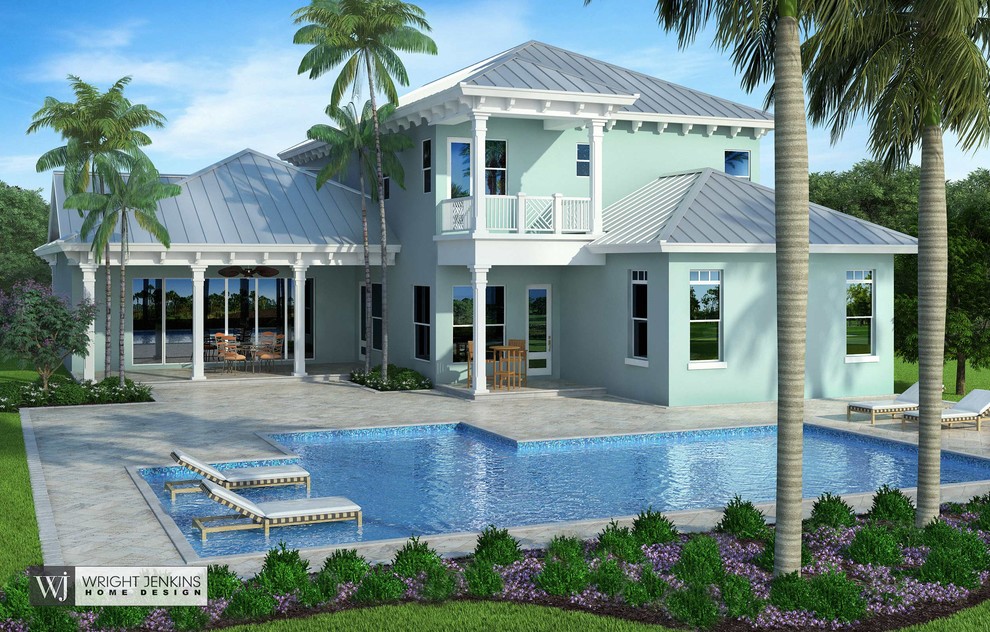 Imagen de fachada de casa azul costera de tamaño medio de dos plantas con revestimientos combinados, tejado a dos aguas y tejado de metal
