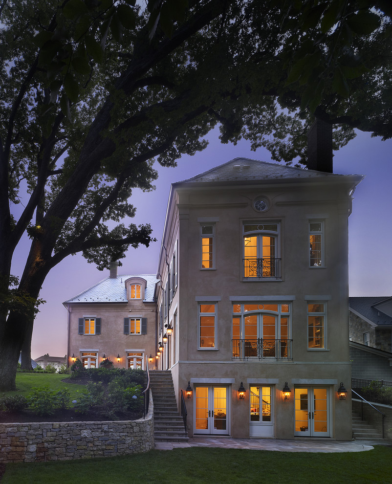 Photo of a large mediterranean house exterior in DC Metro with three floors.