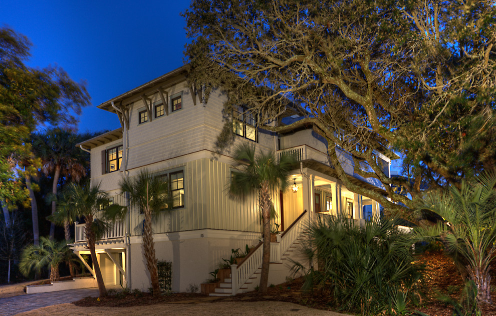 Photo of a green beach style two floor house exterior in Charleston.