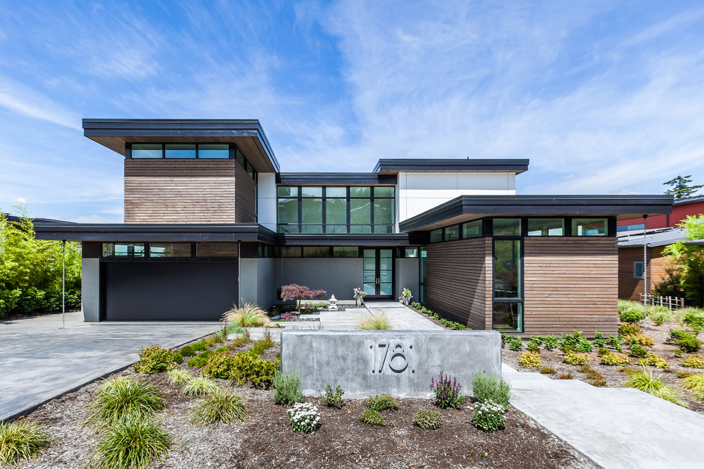 Стильный дизайн: дом в современном стиле с комбинированной облицовкой и плоской крышей - последний тренд