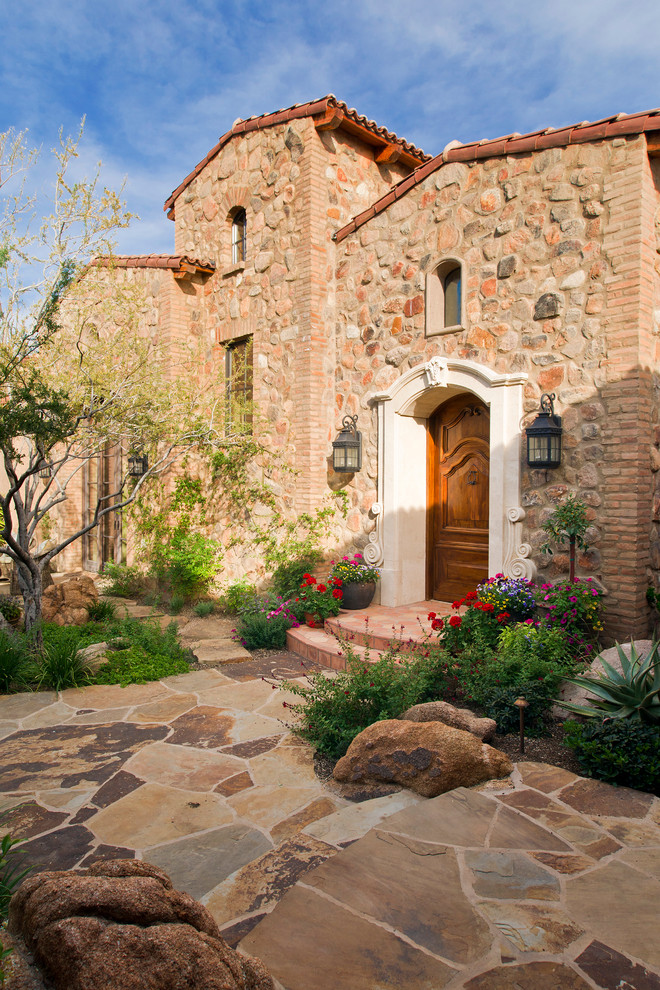 Country stone exterior home photo in Phoenix