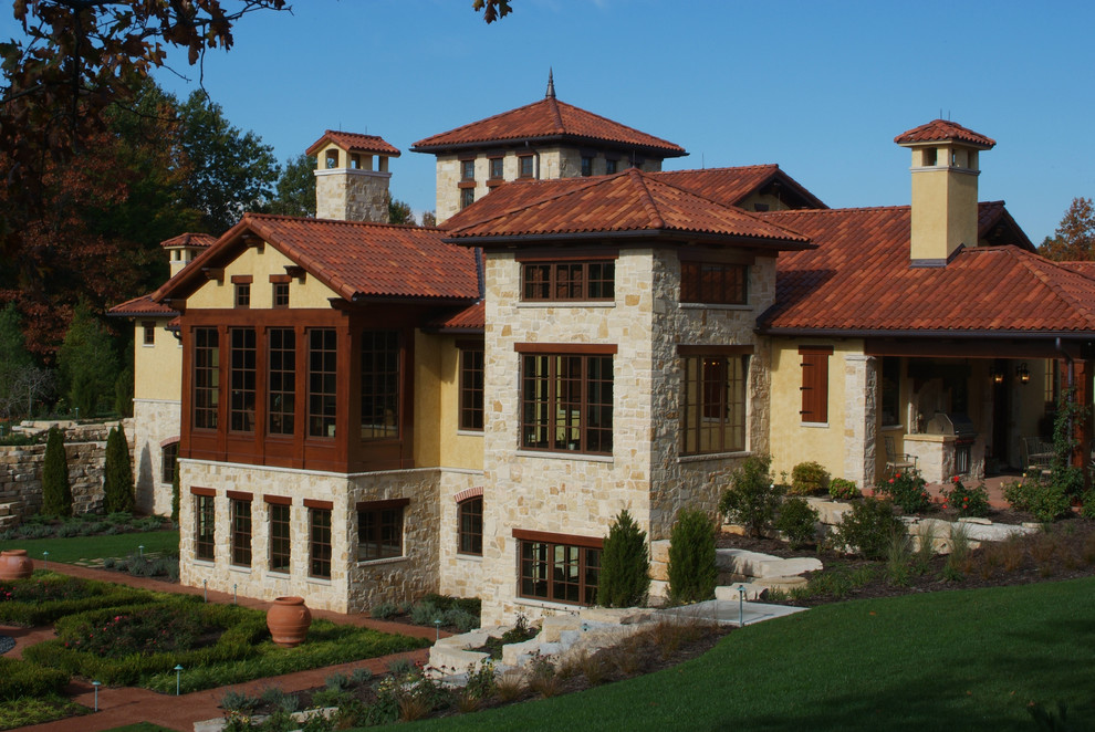 Mediterranean stone exterior home idea in Grand Rapids