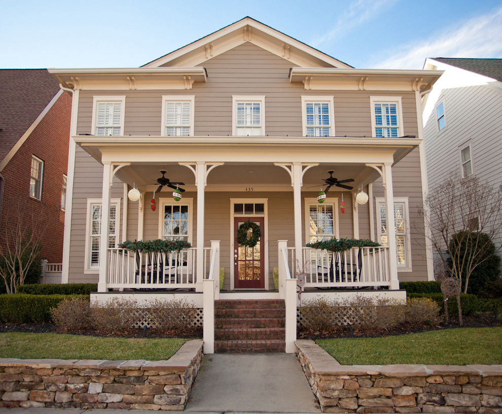 Design ideas for a victorian house exterior in Nashville with wood cladding.