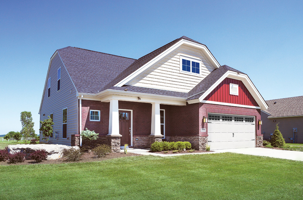 Example of a mid-sized arts and crafts red two-story mixed siding exterior home design in Other