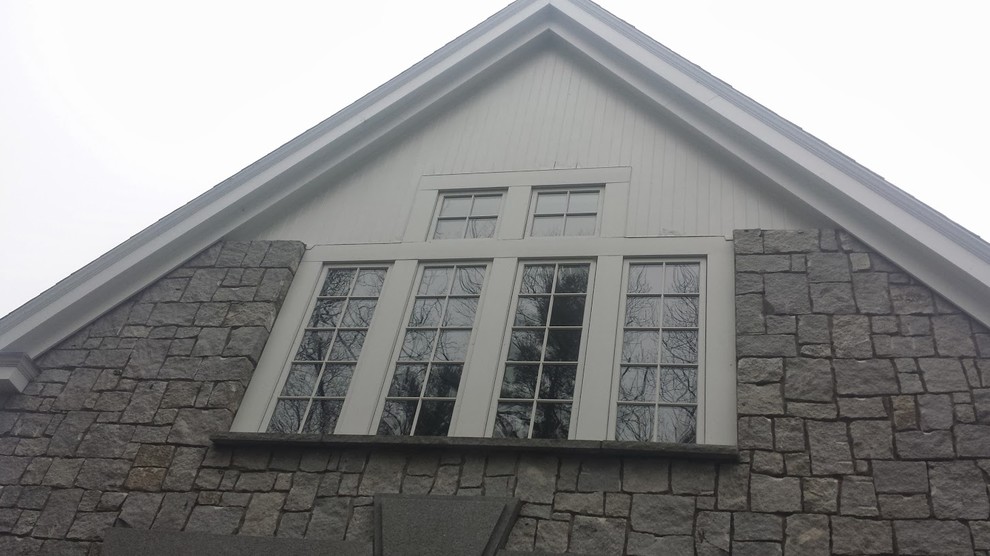 Large rustic two floor house exterior in Boston with concrete fibreboard cladding.