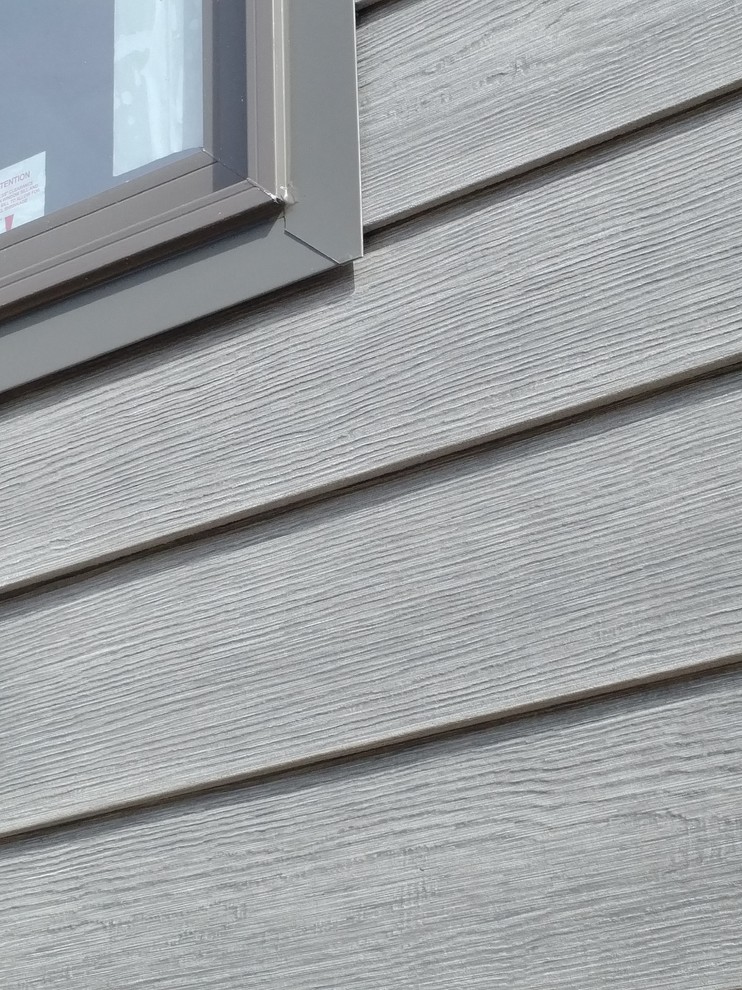 Modern gray concrete fiberboard house exterior idea in Ottawa