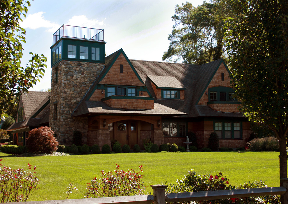 Inspiration for a large timeless brown two-story wood house exterior remodel in Providence with a shingle roof