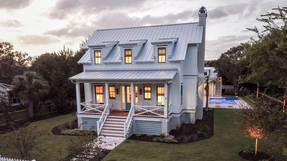 Large coastal white two-story mixed siding exterior home idea in Charleston with a metal roof