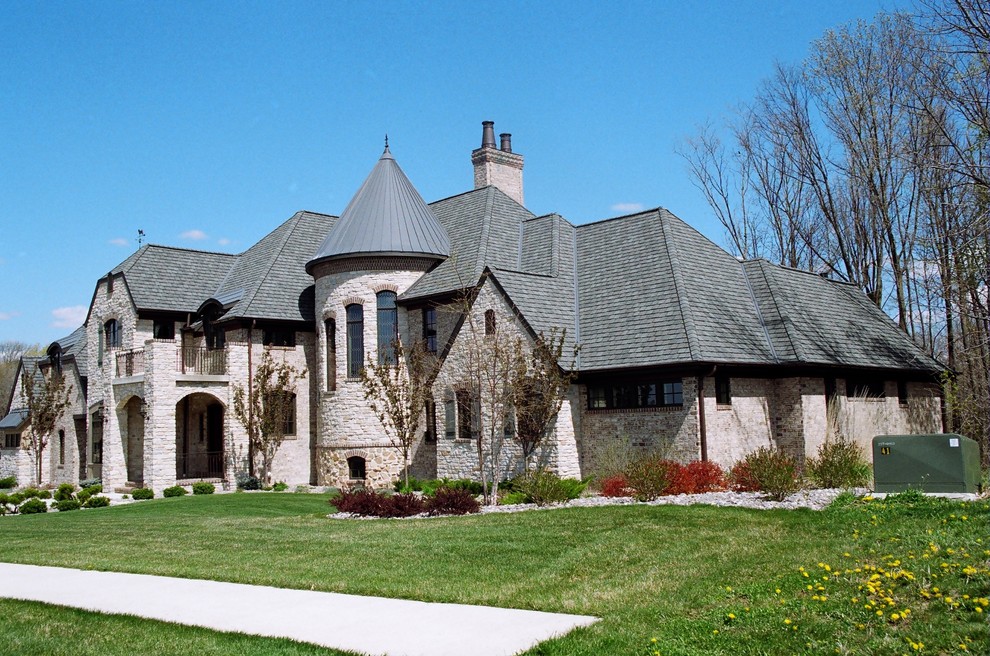 This is an example of a traditional split-level brick house exterior in Other.