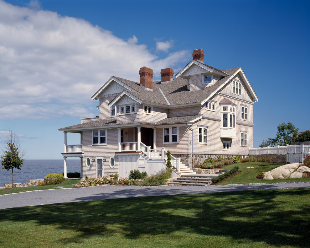 Inspiration for an expansive and gey victorian house exterior in Boston with three floors, wood cladding and a pitched roof.