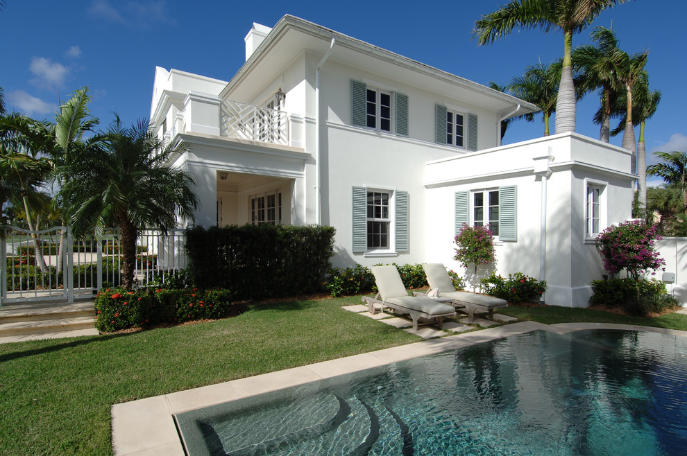 Inspiration for a tropical white exterior home remodel in Miami