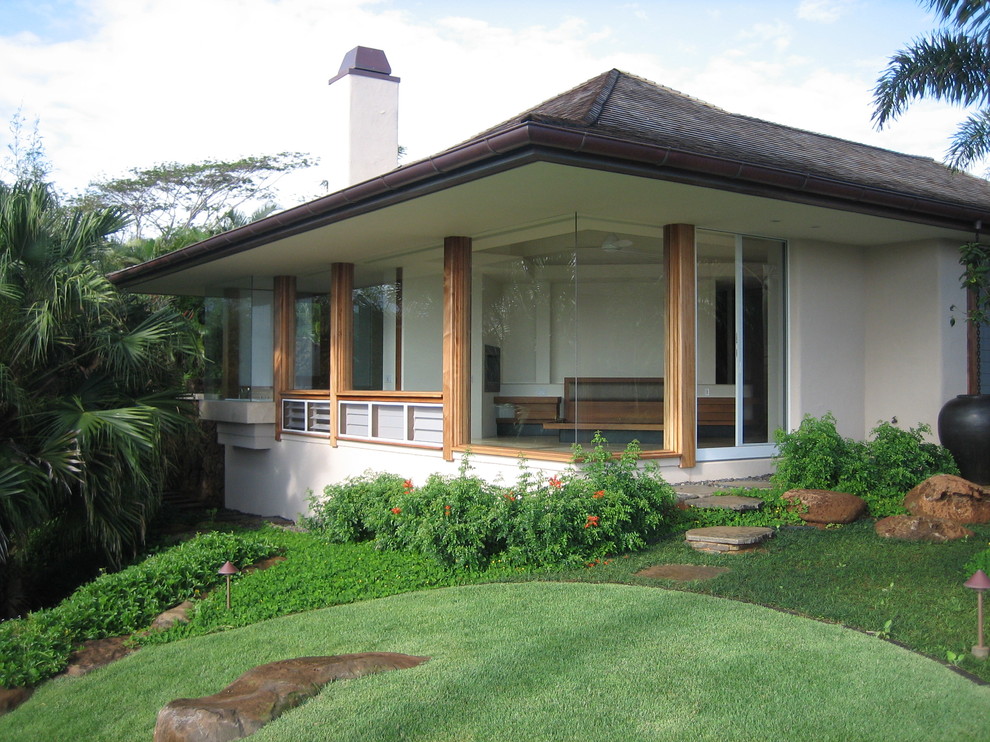Example of a large island style exterior home design in Hawaii