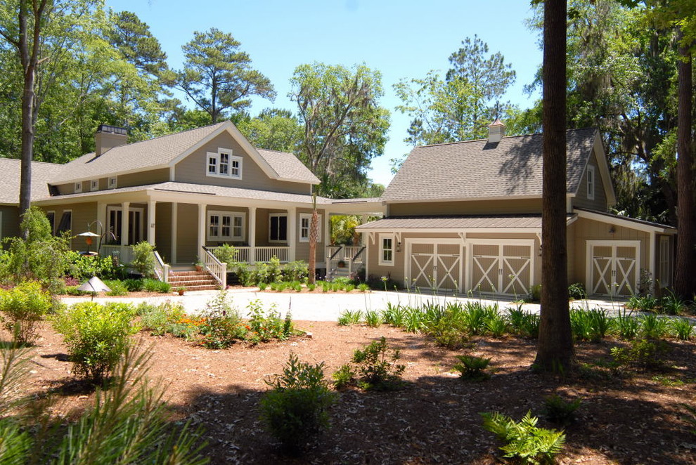 Inspiration for a large timeless brown two-story mixed siding exterior home remodel in Atlanta with a shingle roof
