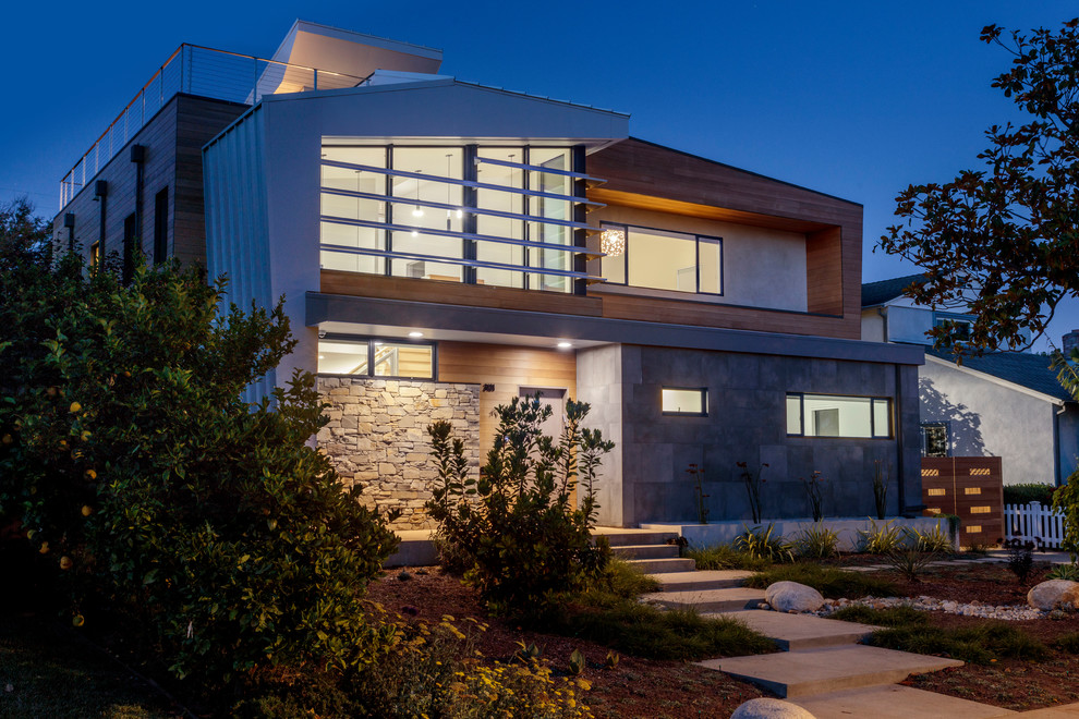 Example of a minimalist two-story mixed siding house exterior design in Los Angeles