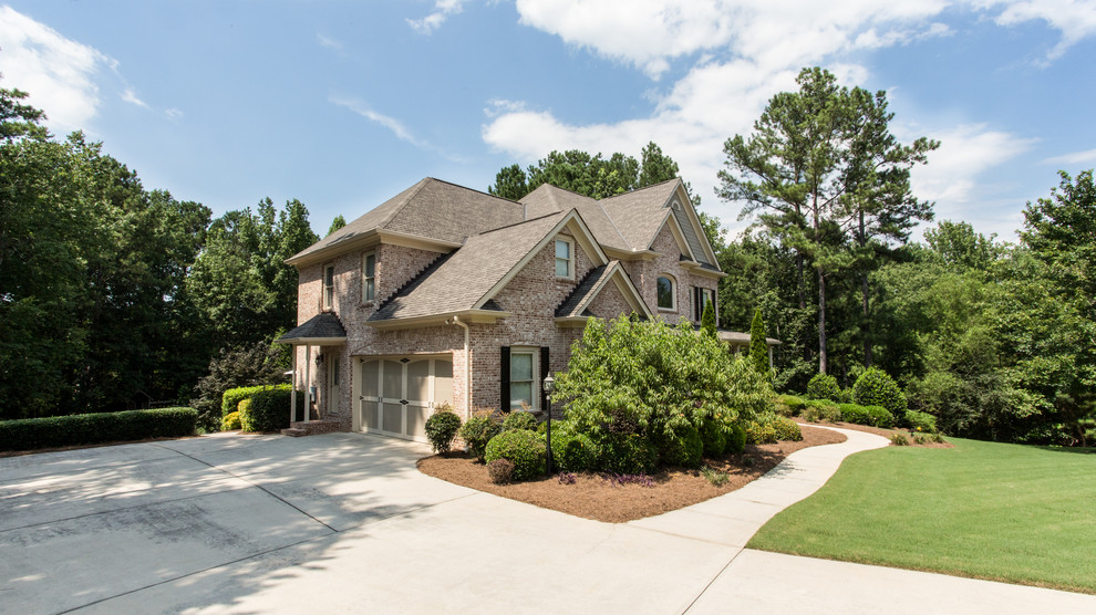 Large elegant two-story exterior home photo in Atlanta