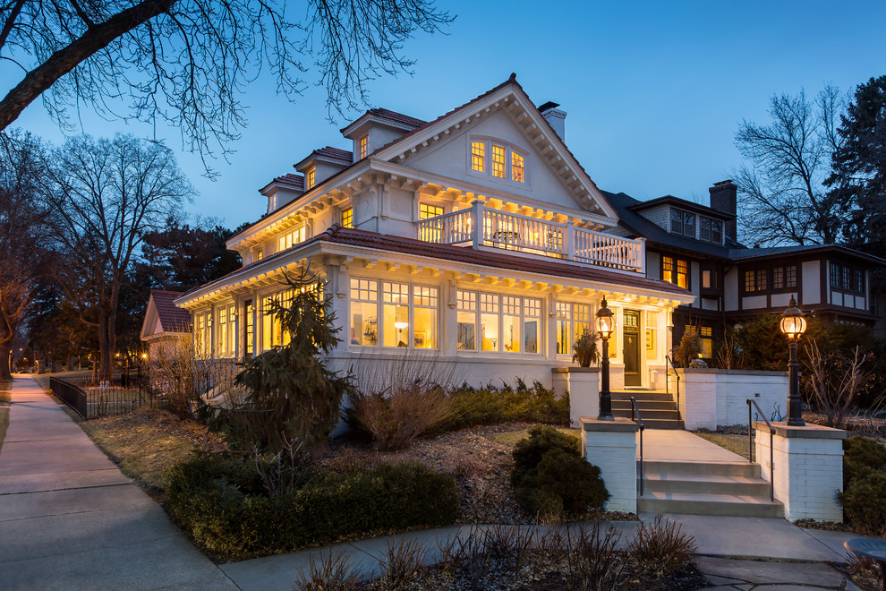 Inspiration for a timeless white two-story exterior home remodel in Minneapolis