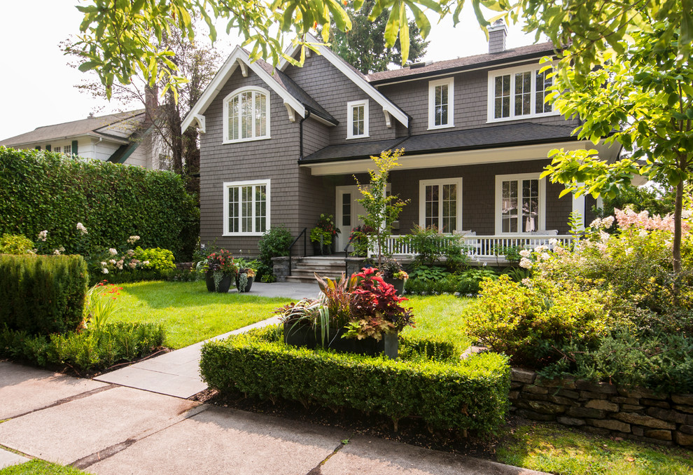Large transitional brown two-story wood exterior home idea in Vancouver with a shingle roof