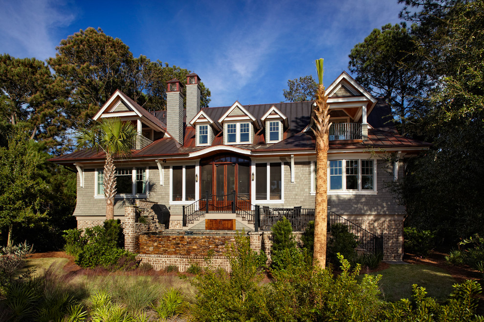 Design ideas for a world-inspired brick house exterior in Charleston.