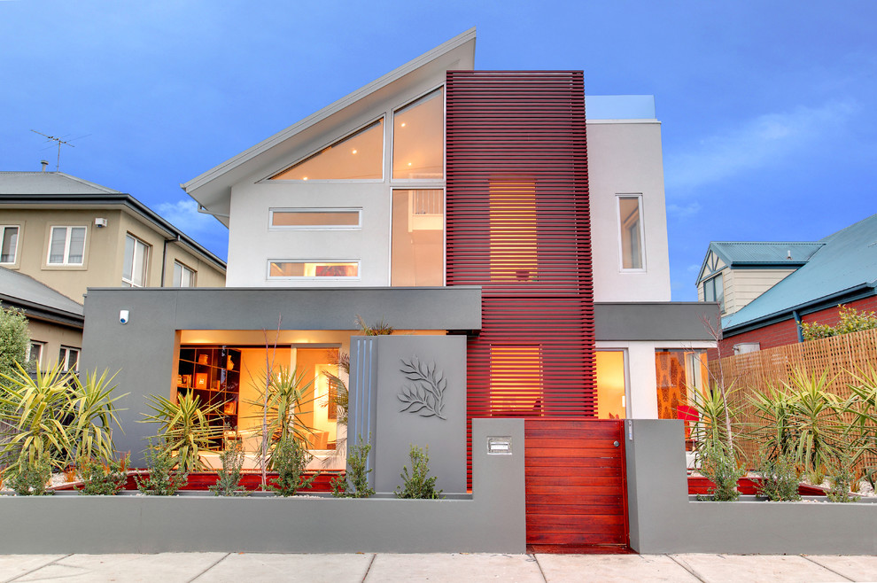 Cette photo montre une façade de maison tendance avec un revêtement mixte.
