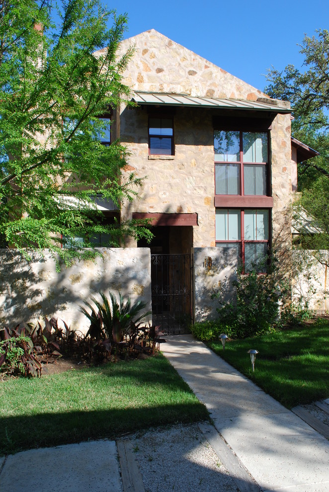 Contemporary stone exterior home idea in Austin