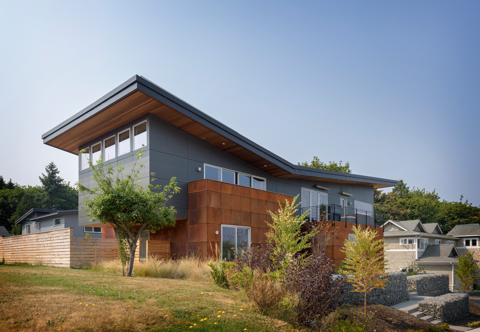 Example of a trendy multicolored two-story mixed siding house exterior design in Seattle