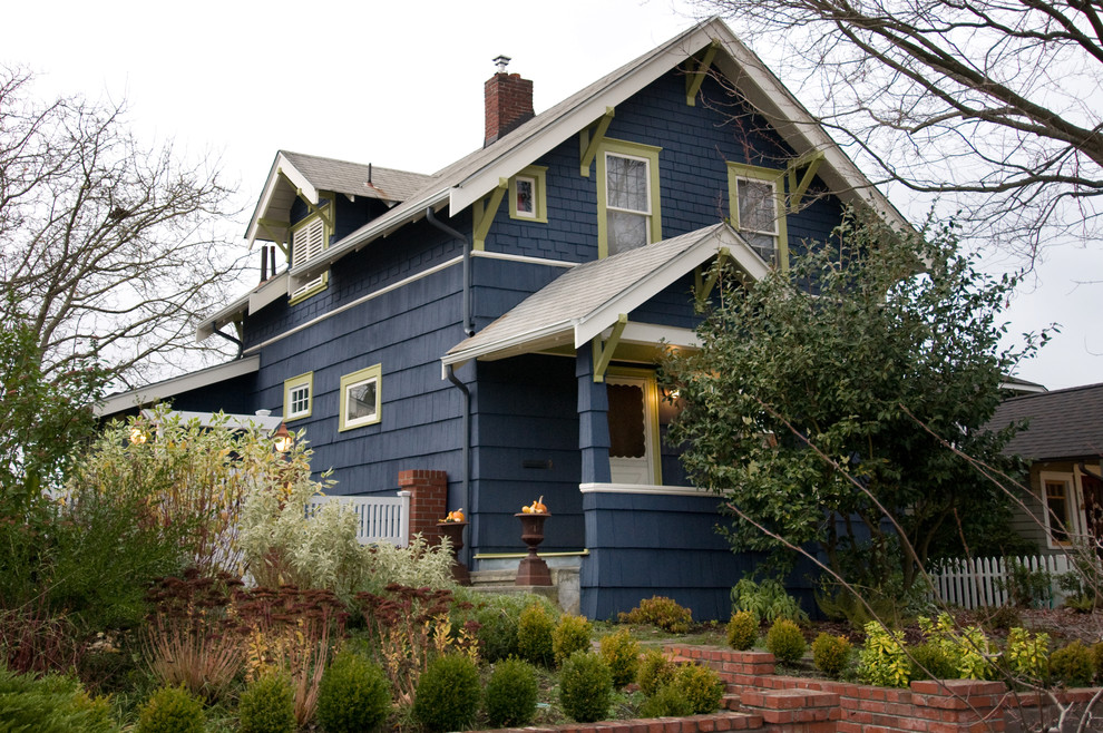 Small traditional two-story wood exterior home idea in Seattle