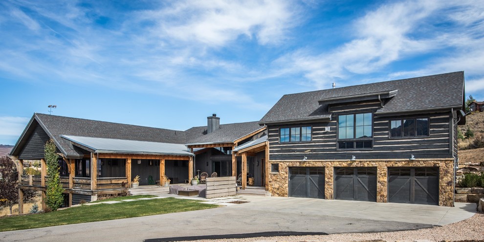 Photo of a large and brown rustic two floor detached house in Salt Lake City with wood cladding, a pitched roof and a shingle roof.