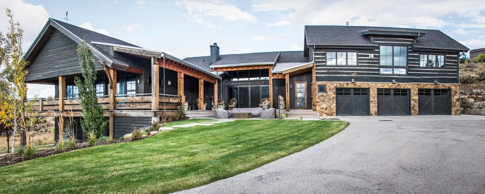 Large and brown rustic two floor detached house in Salt Lake City with wood cladding, a pitched roof and a shingle roof.