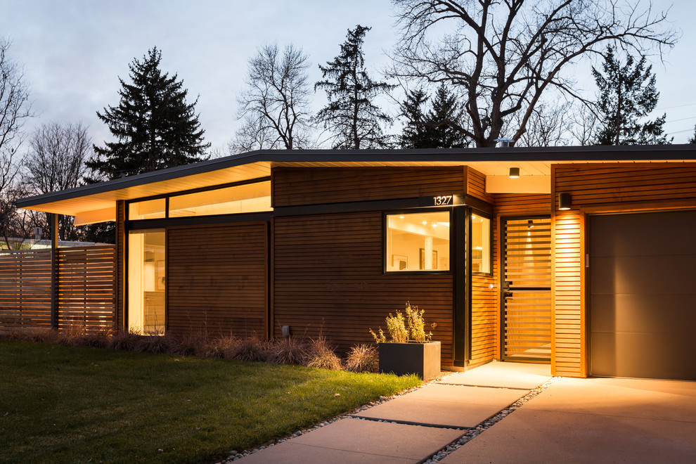 Inspiration for a medium sized and gey midcentury bungalow house exterior in Denver with wood cladding and a flat roof.