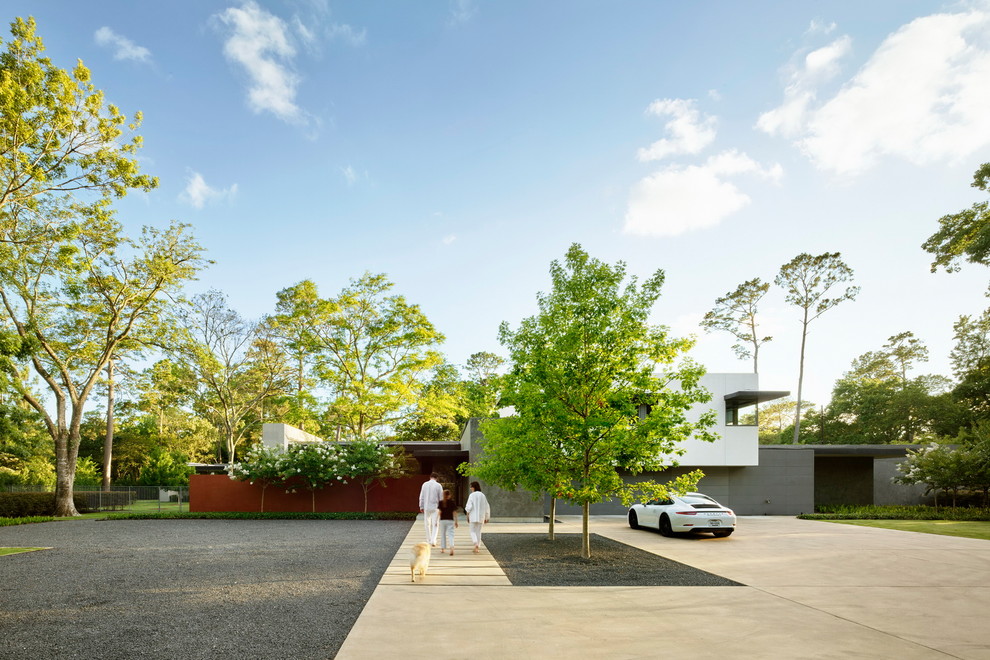 Стильный дизайн: частный загородный дом в современном стиле с плоской крышей и облицовкой из бетона - последний тренд