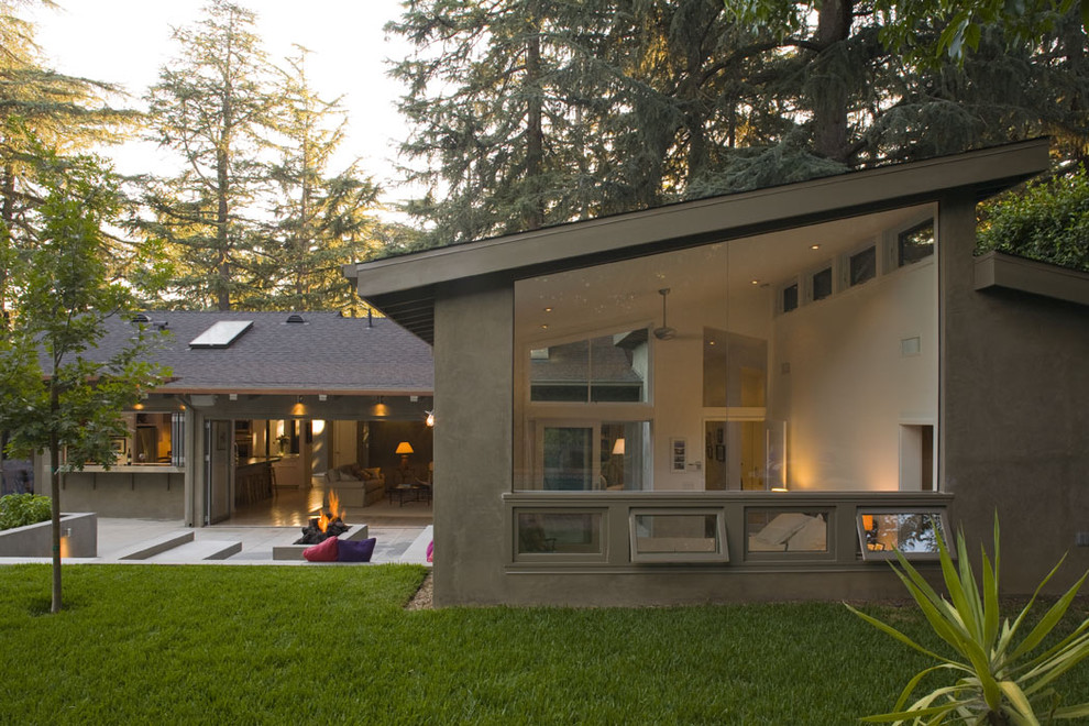 Inspiration for a large and gey contemporary bungalow render house exterior in Los Angeles with a lean-to roof.