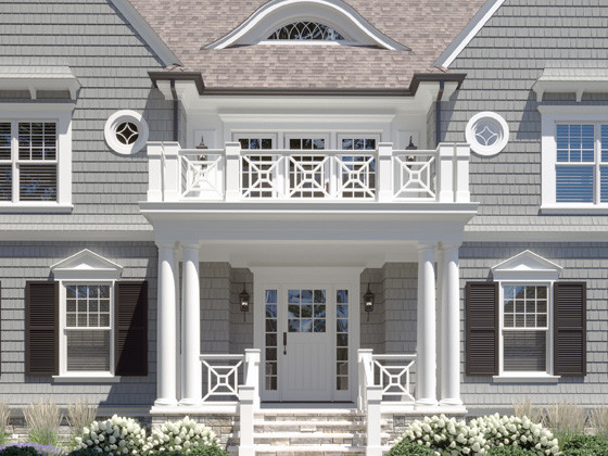 Large beach style gray two-story wood house exterior photo in Chicago with a hip roof and a shingle roof