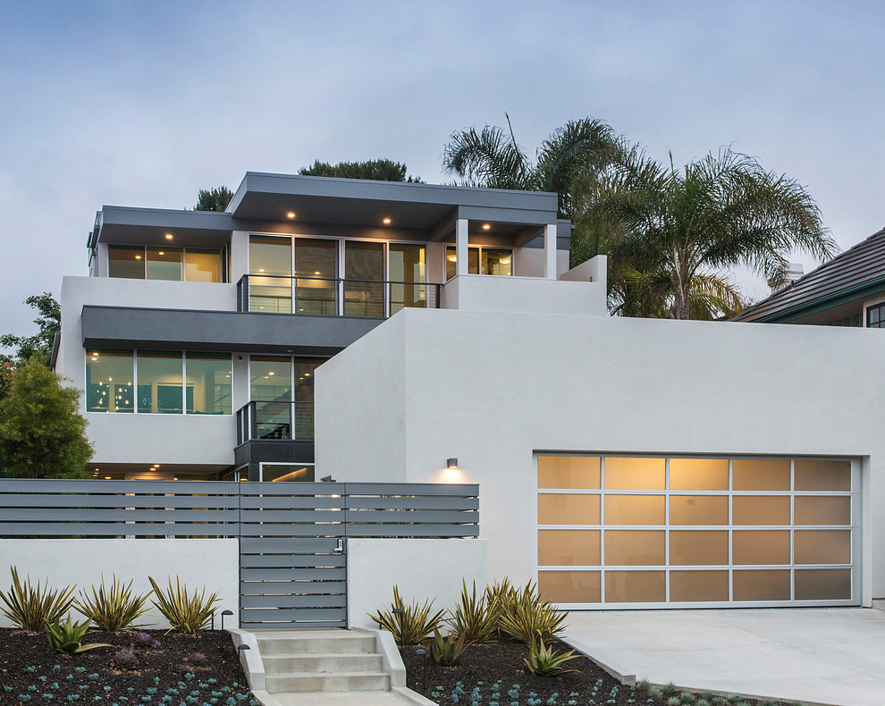 Photo of a large and gey contemporary render detached house in San Diego with three floors.